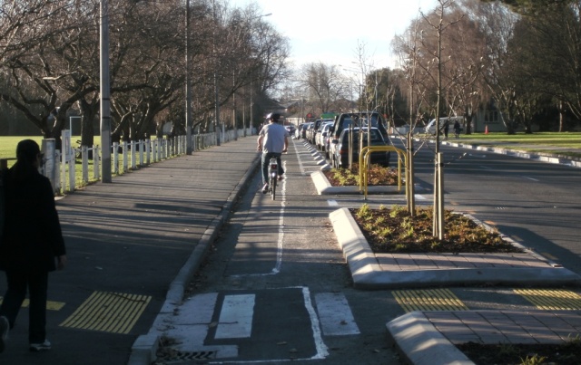 Part of the Iam Road Cycleway. This is outside University of Canterbury and removes bikes from the traffic flow. This form of protected cycleway is the preferred layout where cycleways have to be built on roads. Cycling in Christchurch